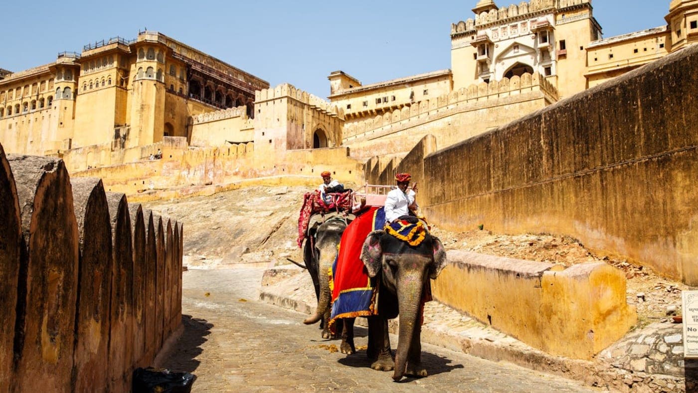 Elephant ride approaching Amber Fort with historic Rajput architecture in Jaipur, Rajasthan.