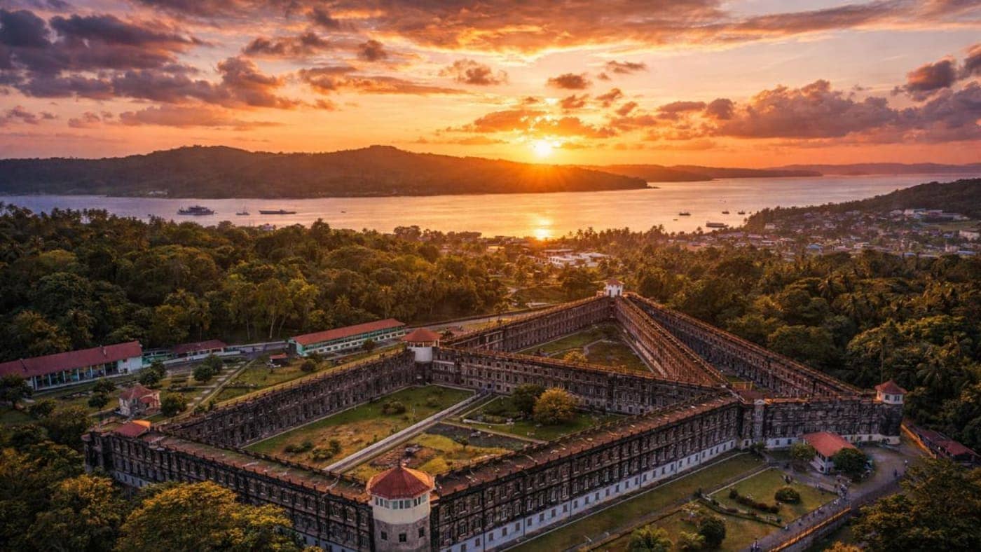 Aerial view of Cellular Jail at sunset overlooking Port Blair and the sea in the Andaman and Nicobar Islands.