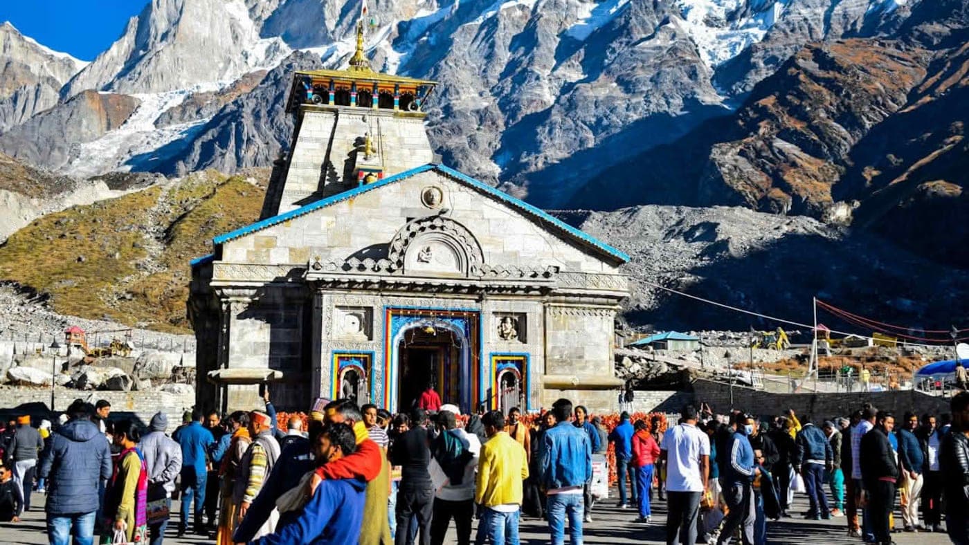 Collage of sacred temples from the Divya Char Dham Yatra including Kedarnath, Badrinath, Yamunotri, and Gangotri in the Himalayas.